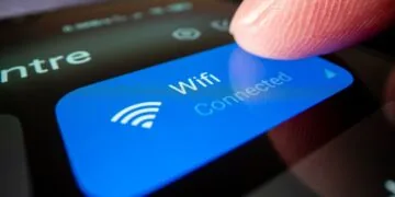 Photo Closeup of Person's Finger on WiFi Button on Smartphone